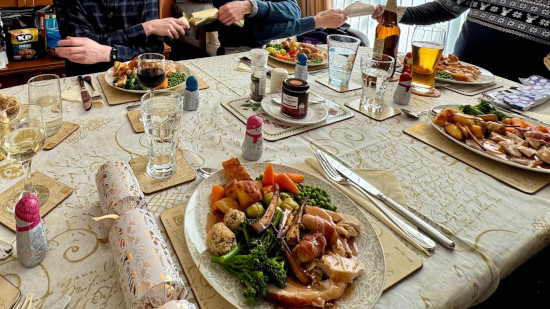 Pulling crackers at a family Christmas dinner